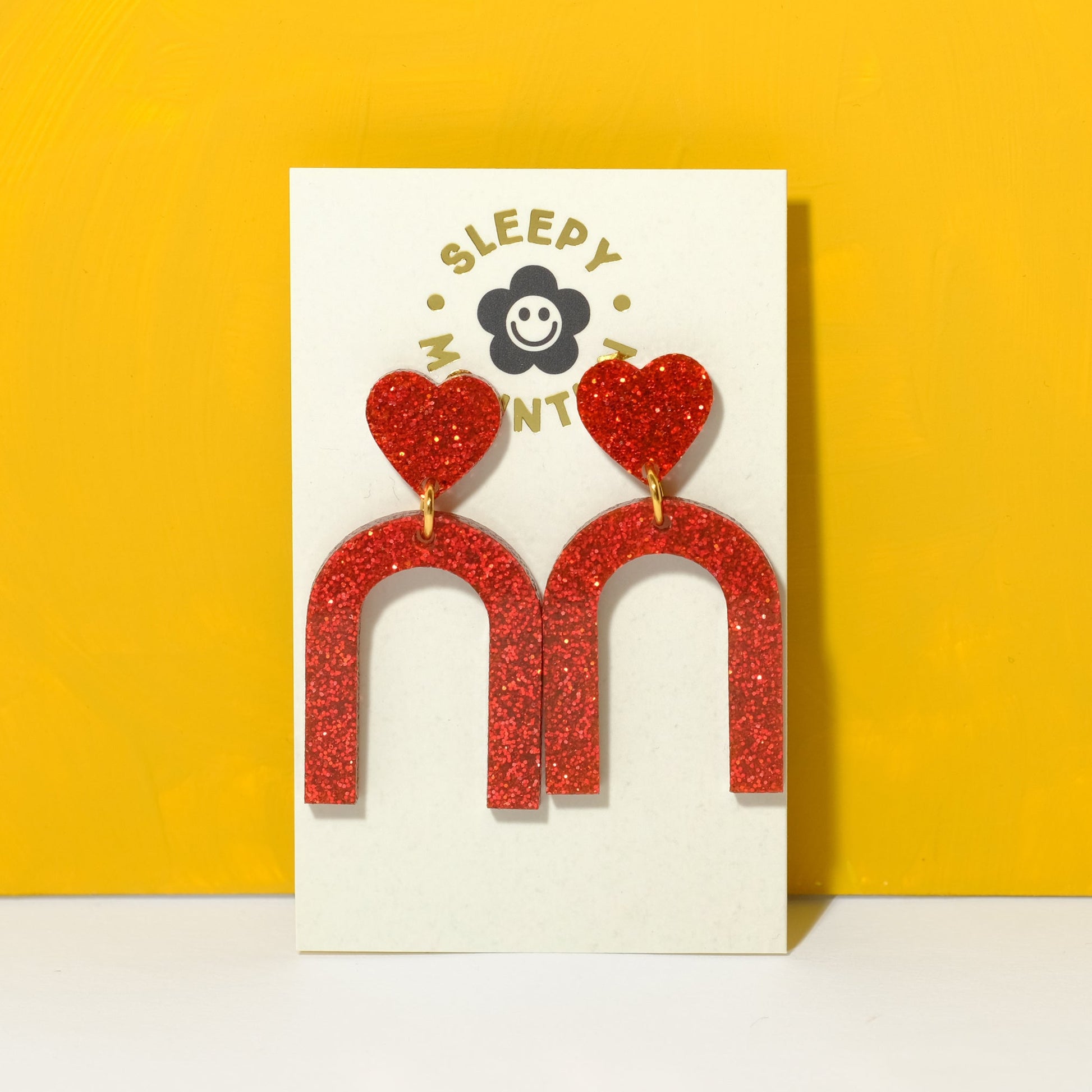 Heart arch dangle earrings in red glitter - Sleepy Mountain