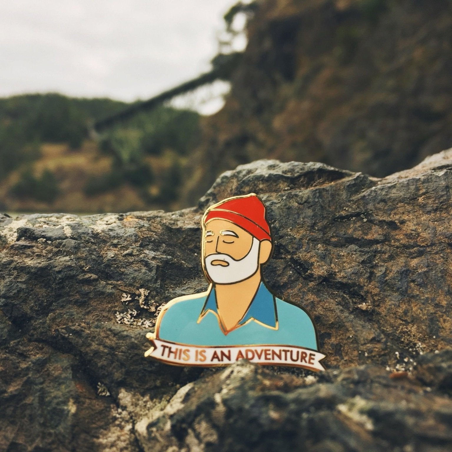This is an Adventure Enamel Pin - Sleepy Mountain